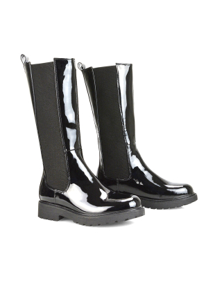 Suzie Flat Low Block Heel Slip on below the Knee Biker Boots in Black Patent