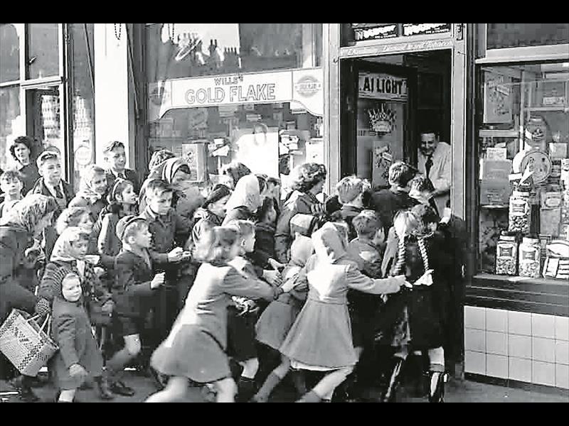 Old photo of shoppers in chaos at a Black Friday sale