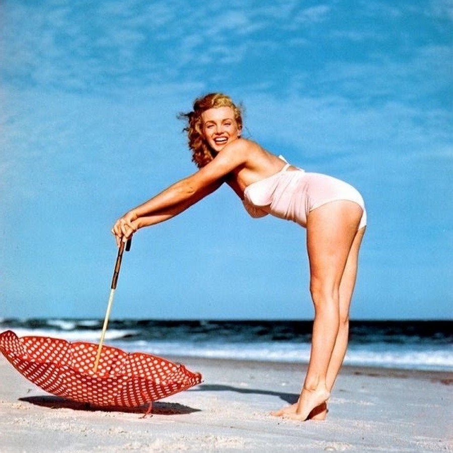 Marilyn Monroe swimsuit photoshoot with umbrella prop