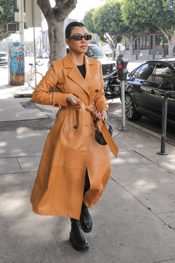 Kourtney Kardashian wearing leather trench coat 