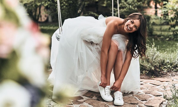 Bride Wearing  Wedding Dress and White Trainers 