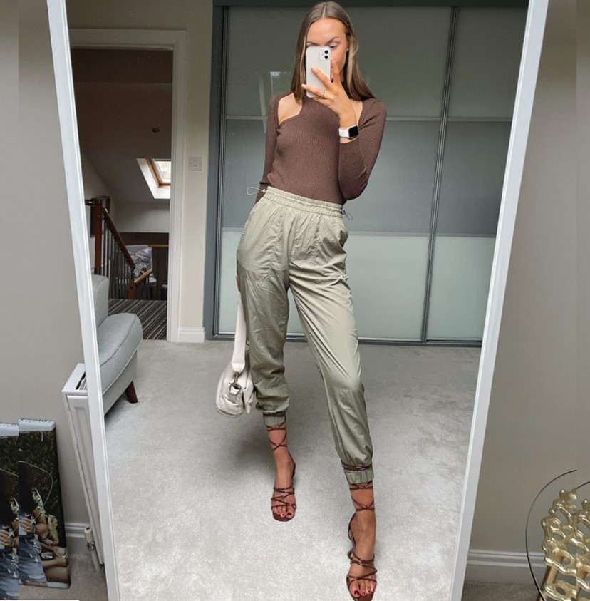 Influencer @bysisterstyle wearing cut out top, high waisted jeans & Lace Up Heels