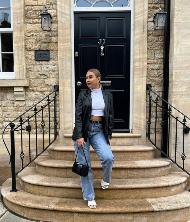 Influencer wearing leather jacket, crop top, flared jeans and Block Heel Sandals